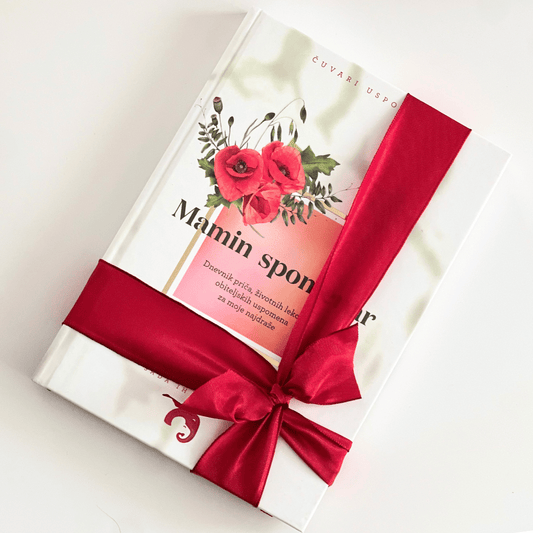 Prekrasno zamotan Mamin spomenar s crvenom vrpcom – savršen poklon za mamu.